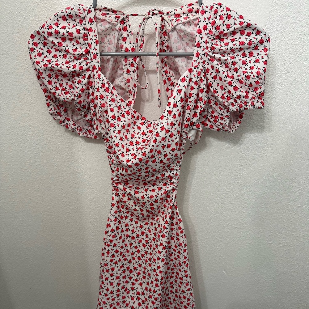 Beginning boutique open black white, pink, and red floral dress.